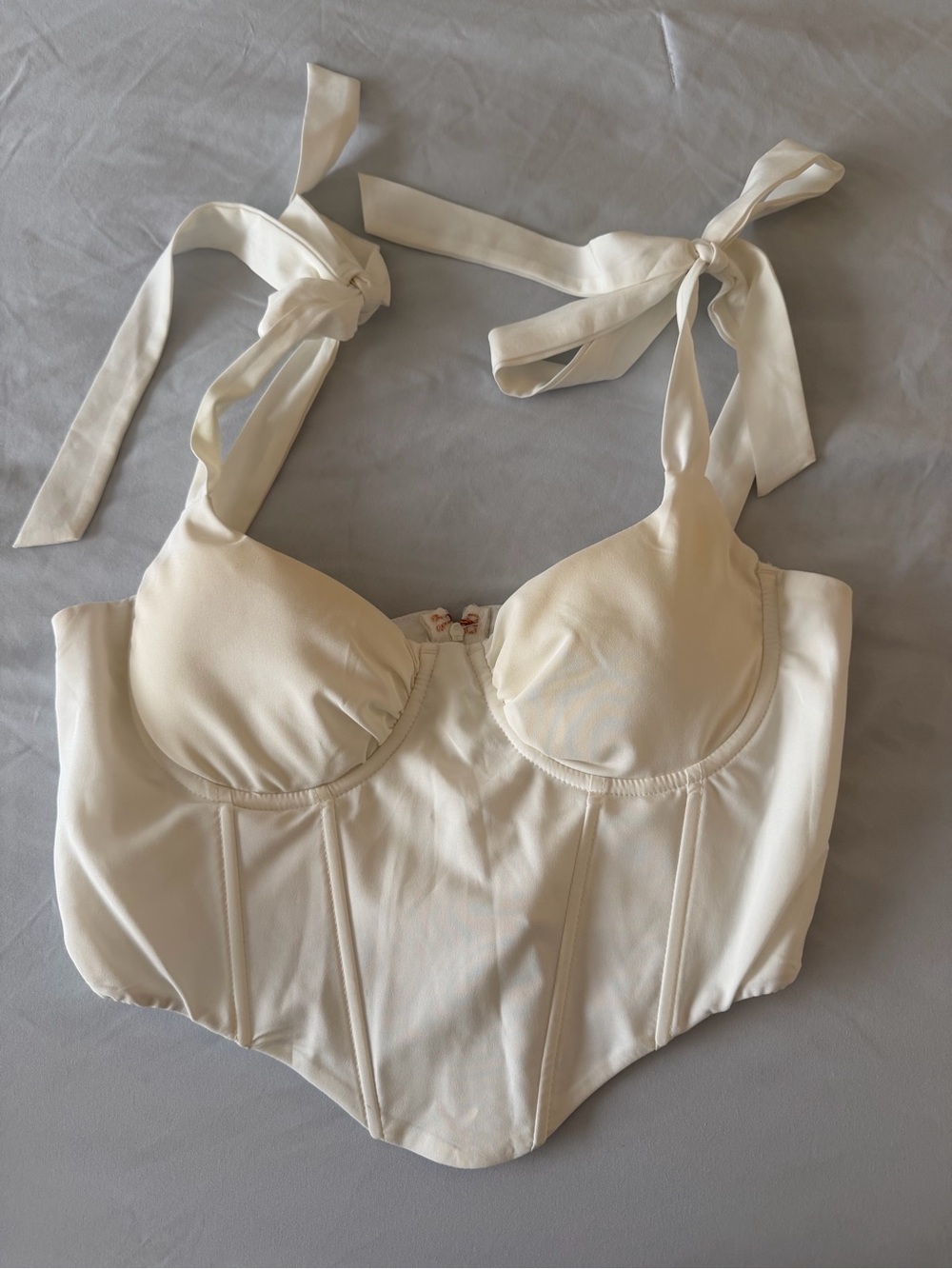 white corset top with bow ties